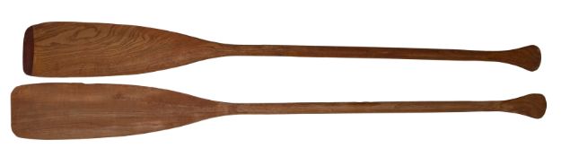 An early 20th century Canadian cedar strip canoe of traditional construction with three seats,