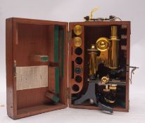 A late 19th/early 20th century lacquered brass microscope, maker James Swift & Son , London,