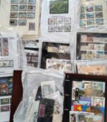 Box with large quantity of Channel Islands and Isle of Man, mostly unmounted mint stamps.