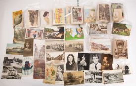 A collection of early 20th century and later postcards, various printers and subject matter,