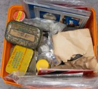 A plastic tub containing boxes and tins of British, Commonwealth and World coin sets, Crowns, notes,