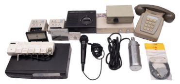 An Eagle Products Stereo Dynamic Microphone, together with a grey push button telephone,