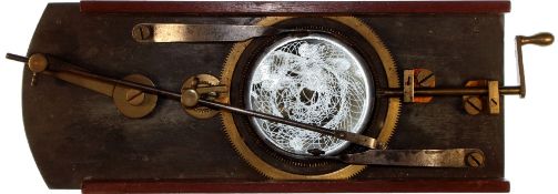 Cycloidotrope [stylus scratches rotary pattern onto smoked glass disc] Maker unknown (11 1/4 x 4 3/8