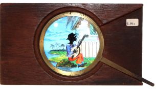 'Black musician playing guitar' [head rocks backwards and forwards] Maker unknown (7 x 4 x 1/2