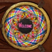 'Welcome' chromatrope Maker unknown (11 1/4 x 4 x 1/2 inches)