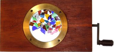 Kaleidoscope slide [coloured fragments move randomly, projected with kaleidoscopic lens] C. Baker,