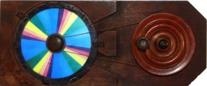 Colour wheel [rotates to show white] Maker unknown (9 3/8 x 3 7/8 x 1/2 inches), pulley *Notes-