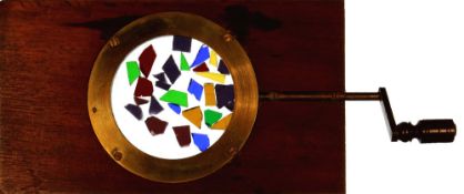 Kaleidoscope slide [coloured fragments move randomly, projected with kaleidoscopic lens] Maker