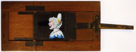 'Woman's nose grows longer' Maker unknown; 8⅜ x 4½ x ⅜ inches, single slip.