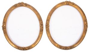 A pair of oval gilt composition picture