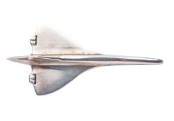 Concorde A Silver aircraft outline lapel badge, together with dust bag in British Airways box, 3,5cm