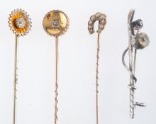 Three stick pins, one horseshoe and pearl, another with small diamond, one marked 15ct,