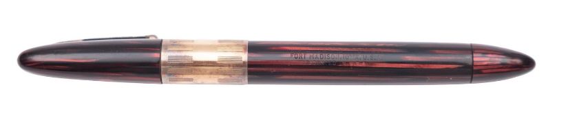 A Vintage Schaeffer 1250 'White Dot' fountain pen, red marbled cap and barrel with gilt clip and cap