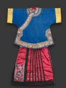 A Blue Silk Short Robe and An Embroidered Burgundy Ground Skirt, Republic period , the rich