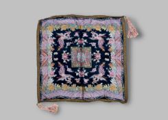 An Embroidered Black Silk Phoenix Square, Republic period, with a flying phoenix at each corner,