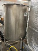 Used approximately 230 gallon stainless steel vertical tank. Approximately 38