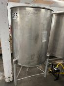 Used approximately 230 gallon stainless steel vertical tank. Approximately 38