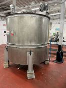 Used approximately 1400 gallon stainless steel vertical mixing tank. Approximately 76
