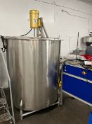 Used approximately 500 gallon stainless steel vertical tank. Approximately 52