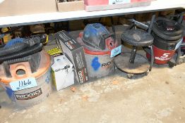 Lot-(3) Portable Shop Vacuums, Accessories, and (1) Rolling Stool on Floor Under (1) Table