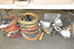 Lot-Various Extension Cords, Lights, Power Strips, and Heater on Floor Under (1) Table