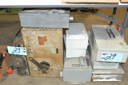 Lot-Various Buss Plugs, Enclosed Safety Switch Boxes and Work Boxes on Floor Under (1) Table
