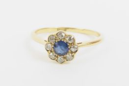 An early 20th century sapphire and diamond daisy c