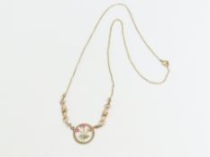 An Edwardian necklace, the central round panel set