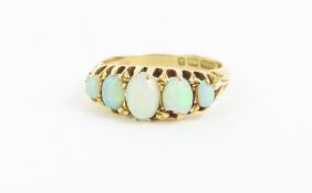 An 18ct gold opal five stone ring, the five oval c