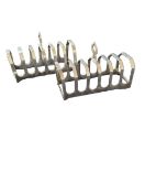 A pair of silver seven-division toast racks, by Vi