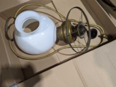 A pendant oil lamp with brass frame and white gla