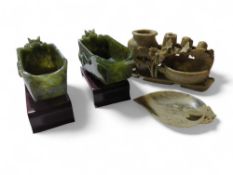 A carved soapstone dish in the form of a lotus bud
