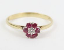 A 9ct gold ruby and diamond cluster ring, finger s