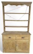 A 20th Century stripped pine kitchen dresser 226cms
