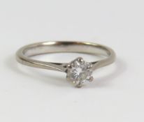 An 18ct white gold diamond solitaire ring, with ce