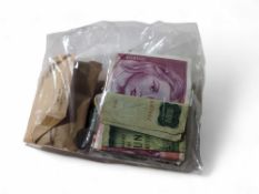 A quantity of assorted foreign coins and banknotes