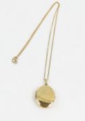 A 9ct gold oval locket with part engraved decorati