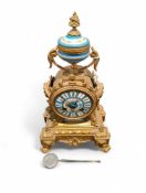 A French gilt metal and painted porcelain mantel c