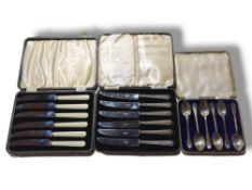 A case set of silver tea spoons, with gold motifs