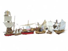 A collection of wood and painted wood historic sailing ship