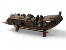 A Chinese carved bamboo boat with figures, 25cms l