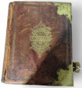 A large leather Welsh Bible with decorative gilt b