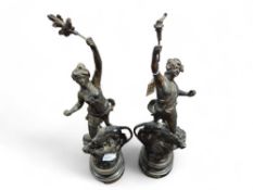 A pair of bronzed spelter figures La Forge and Le