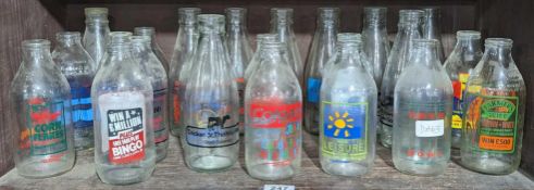 A collection of milk bottles with colourful advert