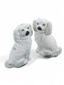 A large pair of white glazed Staffordshire spaniel