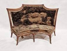 19th century walnut framed settle, carved support, raised on seven splayed feet, the front three