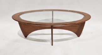 Mid-century G-Plan teak Astro oval coffee table with glass top, raised on curved supports, 42cm high