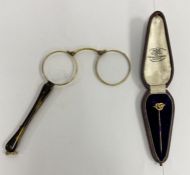 Pair of gold coloured and tortoiseshell folding spectacles and a 15ct gold hat pin in a fitted