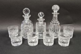 Waterford cut glass decanter, two further cut glass decanters and a set of six cut glass tumblers (