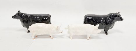Two Beswick models of Aberdeen Angus bulls, a Beswick model of a pig inscribed 